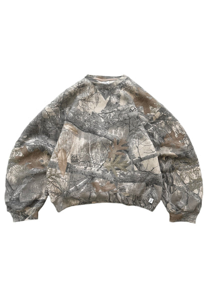 Akimbo Camo Sweater by Obscure Collective in front view, featuring a bold camo pattern. The sweater is displayed on a white background, showcasing streetwear style.