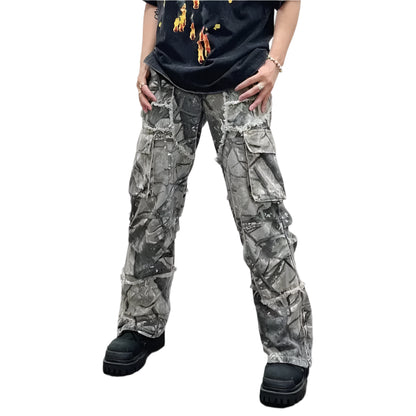 Front-facing image of a model wearing Obscure Collective's Camo Pants, highlighting the bold camouflage print and streetwear-inspired fit in an urban style.
