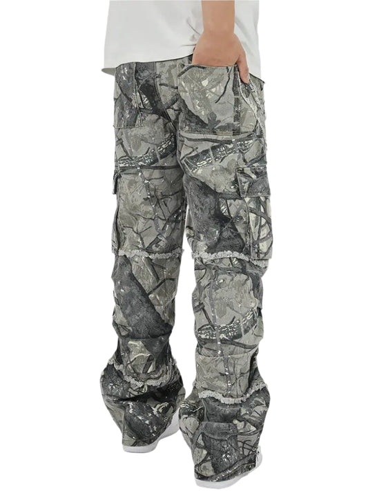 Side-rear view of a model wearing Obscure Collective's Camo Pants, highlighting the bold camo pattern, functional pockets, and streetwear-inspired fit.