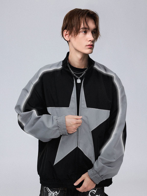 Model wearing Obscure Collective's Star Bomber Jacket in grey, standing confidently, showcasing the bold star embroidery and sleek streetwear design, set against a grey background.