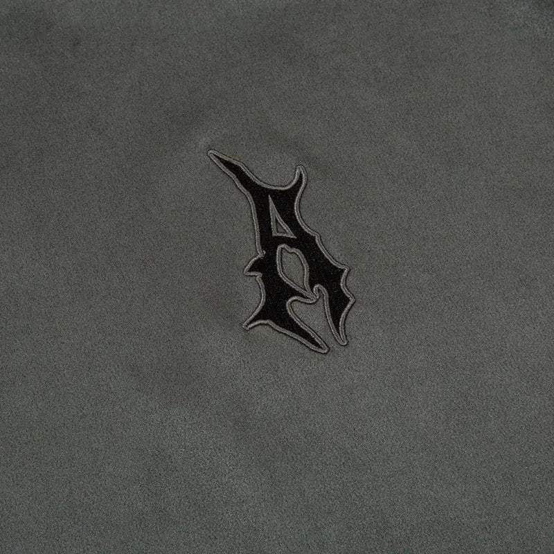 close up logo image of grey streetwear suede shirt