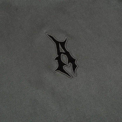 close up logo image of grey streetwear suede shirt